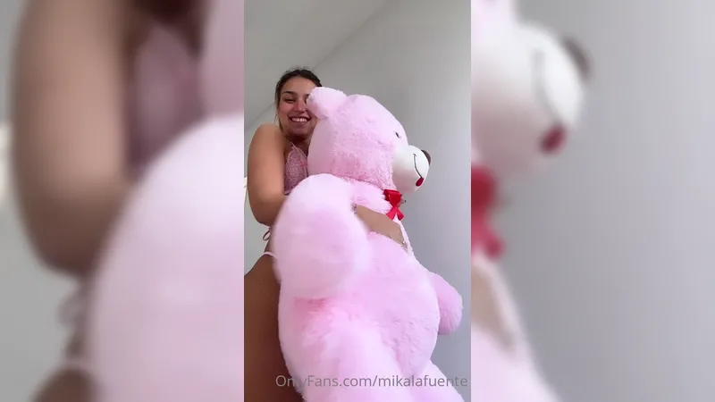 Mika Lafuente playing with teddy bear 1/3