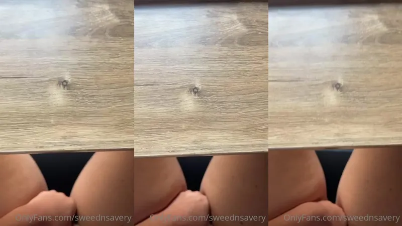 sweednsavery rubbing pussy under the table in this OnlyFans video