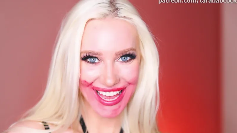 TaraBabcock Blonde Shows Off Her Assets in a Black Bondage Outfit Video