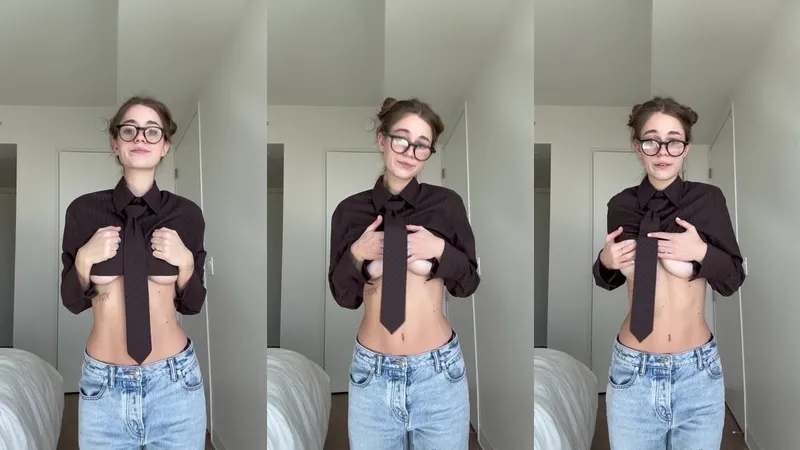 Anna Malygon In Nerdy Glasses And Tie While Stripping Down In Bedroom Video
