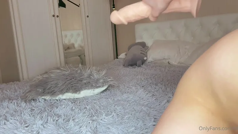Seltin Sweet Petite Cutie Sucks a Dildo After Getting Naked on Bed Video