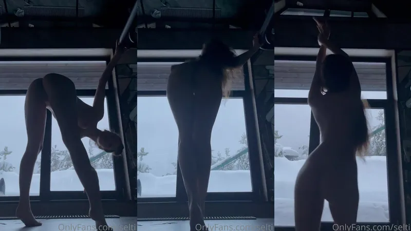 Seltin Sweety Strips Naked Showing Her Perfect Curves In Front Of Snowy Window