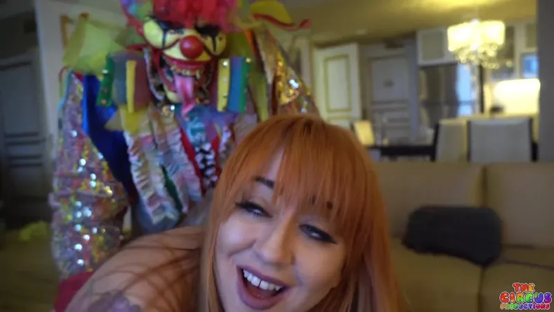 GIbbyTheClown stars in a clown-themed porn video where she unleashes her wild side in a luxurious setting
