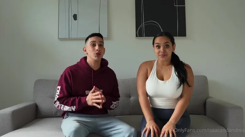 Isaacandandrea tease playful kisses in casual wear in this OnlyFans video