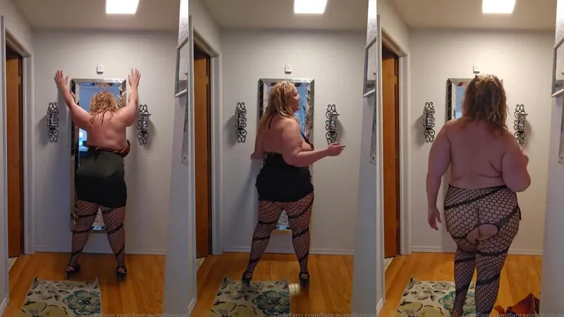 Curvy Goddess Ursula Andreia aka fantasymilfursula from OnlyFans shows off her thick thighs in black fishnet stockings and a tight black dress