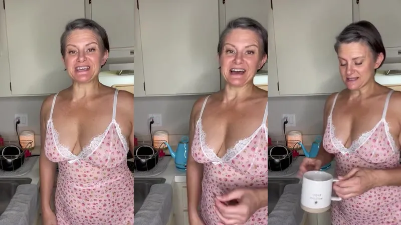Curious Carly aka carly_579 shows off her perfect body in a pink nightie while teasing in the kitchen in her latest OnlyFans video.
