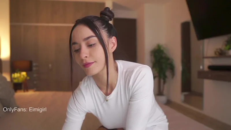 Emyii Teases Her Slender Frame in Steamy Porn Video