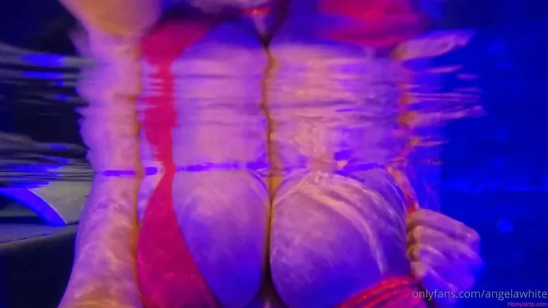 Angela White Teases in Moonlit Poolside Video
