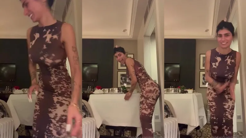 Mia Khalifa Teases Her Massive Juggs in Strip Show Video