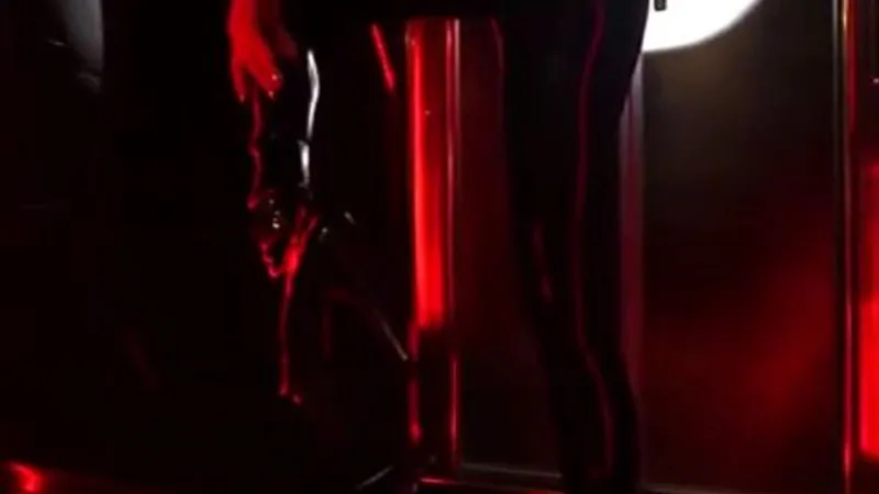 Naughty Russian Cosplay Babe Teases in Tight Black Latex Catsuit Video