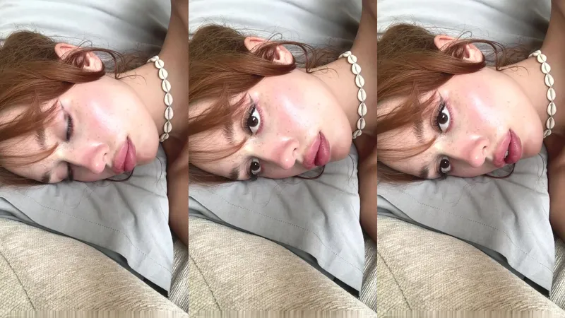 18 Sexy redhead nude, sultry gaze and pearl tease.