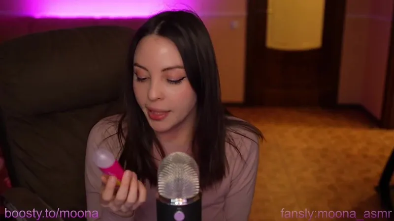 Moona__asmr Fansly star performs ASMR with microphone and playing tits.